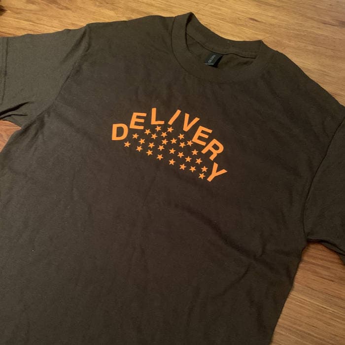 Delivery orange on brown stars tee